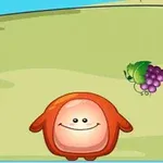 オレンジ色の丸いキャラクターが緑の草原に立っており、近くにはブドウのイラストがあります。