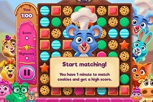 カラフルなクッキーとキャラクターが並ぶゲームの画面で、中央にコック帽をかぶった青いネズミのキャラクターがいる。