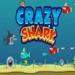 青い背景の海の中に、「CRAZY SHARK」の文字、カラフルな魚、潜水艦、海底の植物や障害物が描かれている。