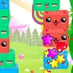 カラフルなキャラクターのブロックが積み重なり、星型のアイテムが飛び散る様子。