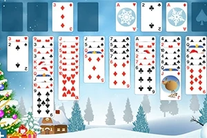 冬の背景にトランプのカードが並び、左下にクリスマスツリーと小さな家が描かれているイメージ。