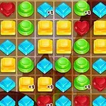 カラフルなジェムが並んだパズルゲームのグリッド。