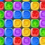 カラフルな正方形のブロックに星、貝殻、ベル、蝶の模様が描かれているパズルのイメージ。