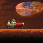 トンネル内で小さな赤い車に乗ったキャラクターが、地面の上を進んでいる。
