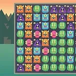 カラフルなモンスターのイラストがグリッド状に並んだパズルのスクリーンショット。
