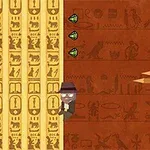 探検家のキャラクターが壁に描かれた古代エジプト風の壁画の前で3つの緑の宝石を集めているイメージ。