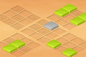 砂色の背景に、グリッド状に並んだ正方形のタイルがあり、緑と灰色のタイルが配置されている。