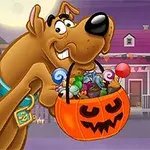 大きな犬がハロウィンのカボチャバスケットをくわえており、中にはキャンディがたくさん入っている。