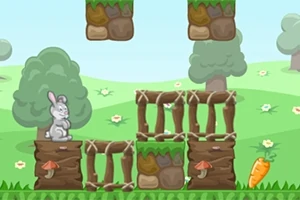 緑の丘と木々を背景に、ウサギとニンジンが草の上のブロックに配置されているイラスト。
