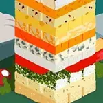 ネズミがチーズとハーブの層を積み重ねたタワーを食べようとしている。